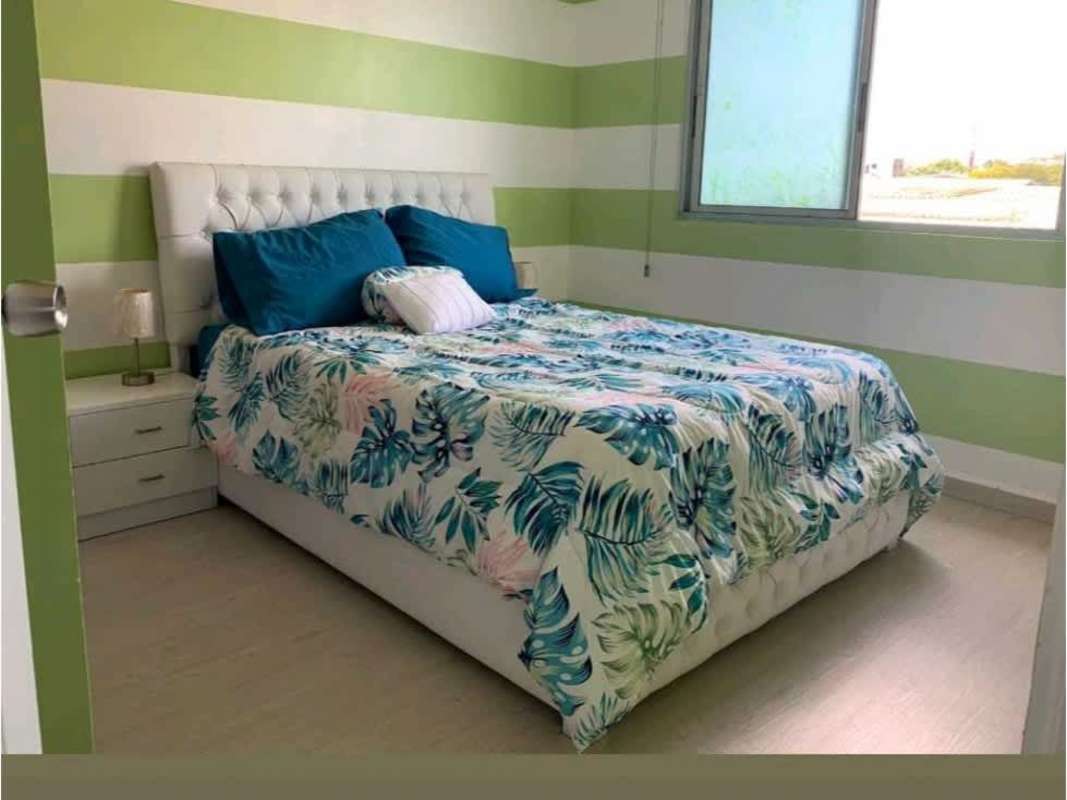 Traditional bathroom with bamboo glass shower door and blue accents at PH Bosque del Castilla Panama City
