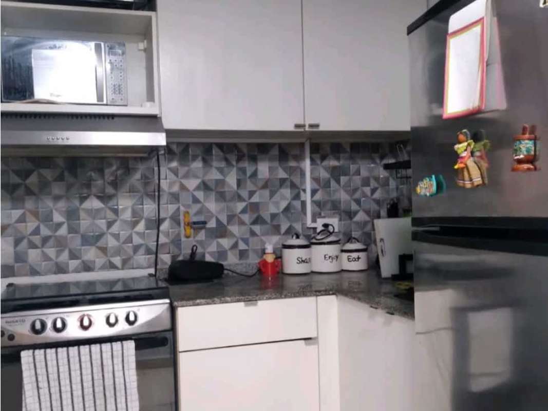 Dining area with brick wall, table and pendant light at PH Bosque del Castilla Rio Abajo Panama City