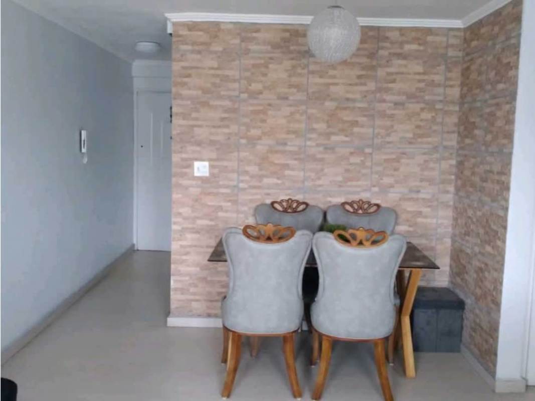 Modern bedroom with striped green-white wall, tufted bed at PH Bosque del Castilla Panama City