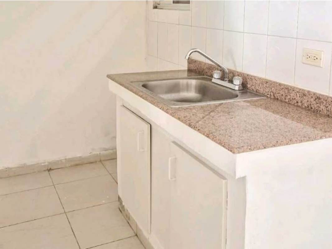 Minimalist kitchen with granite countertop and tile floors PH Villas del Naranjal Pedregal Panama