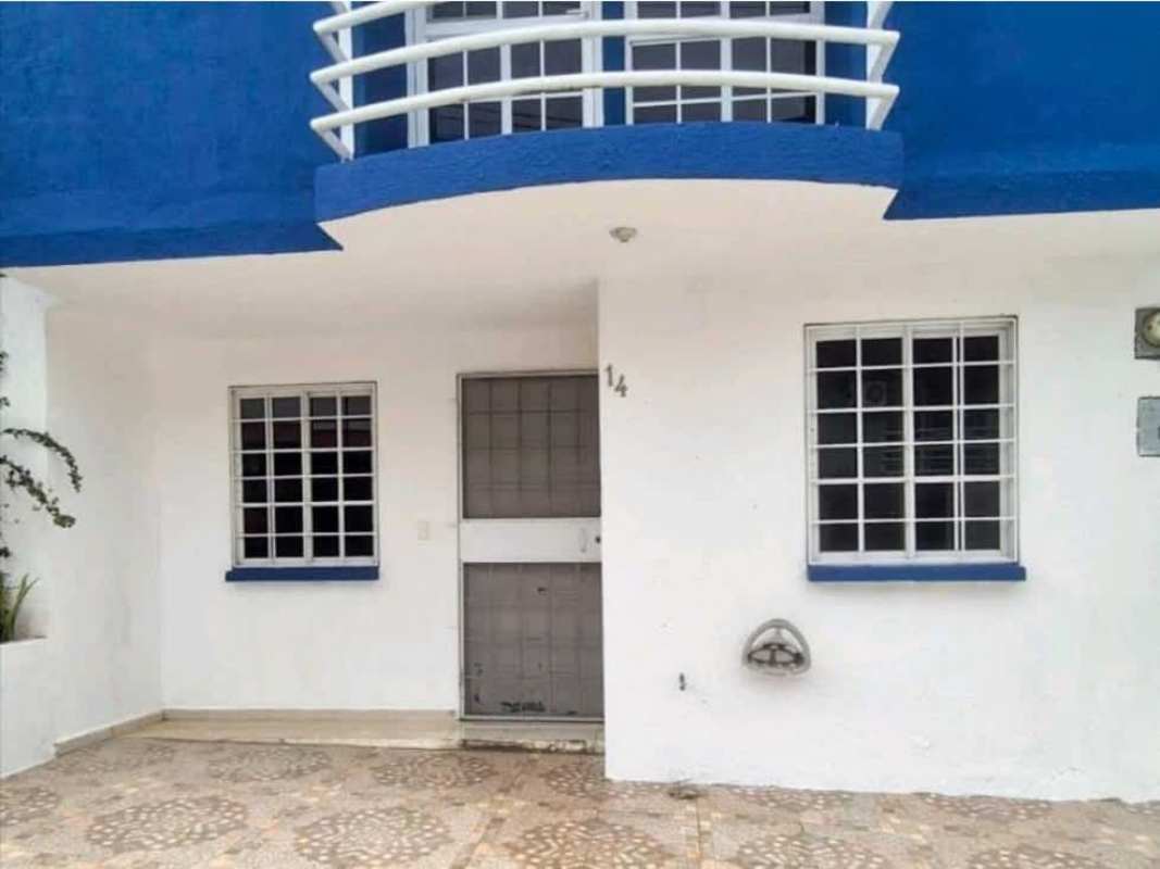 White and blue house facade with balcony for sale in Pedregal Panama duplex Villas del Naranjal