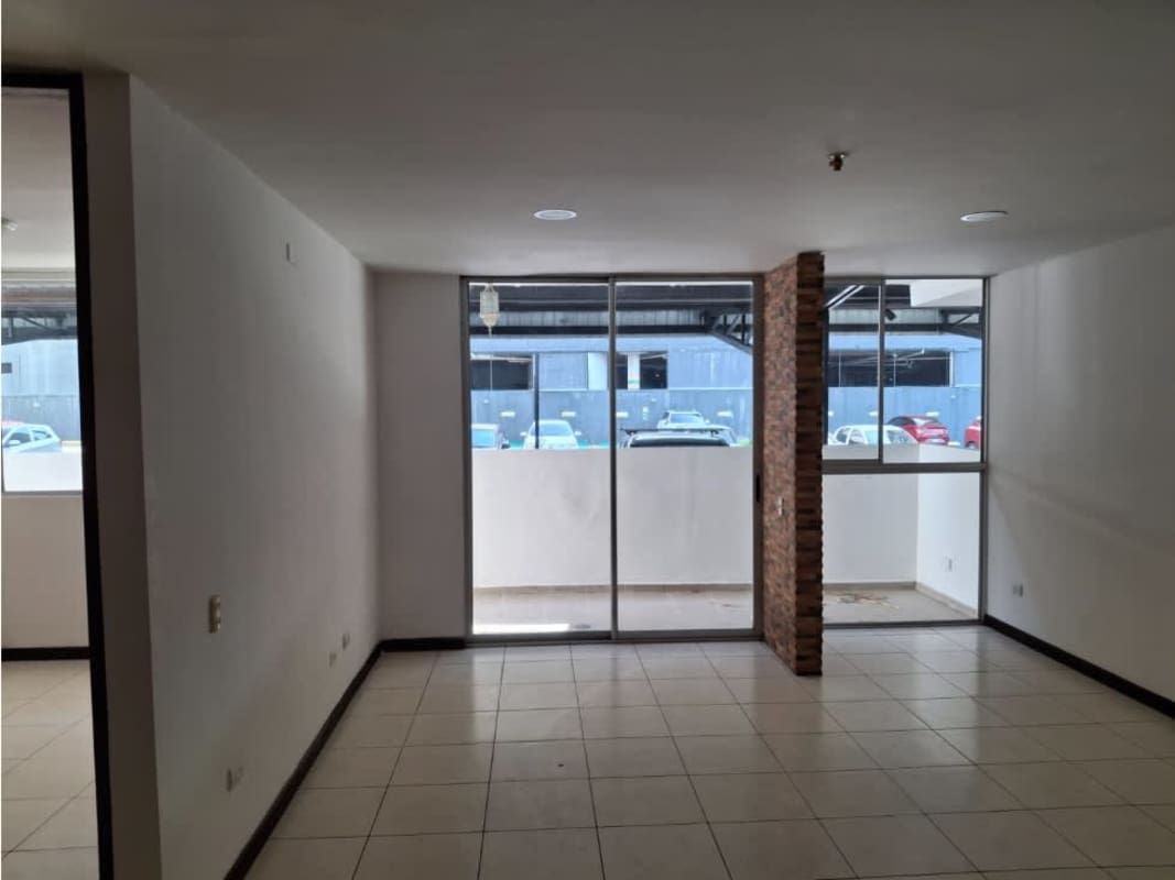 Living room with sliding glass doors to balcony PH Altavista Tower Don Bosco Panama City