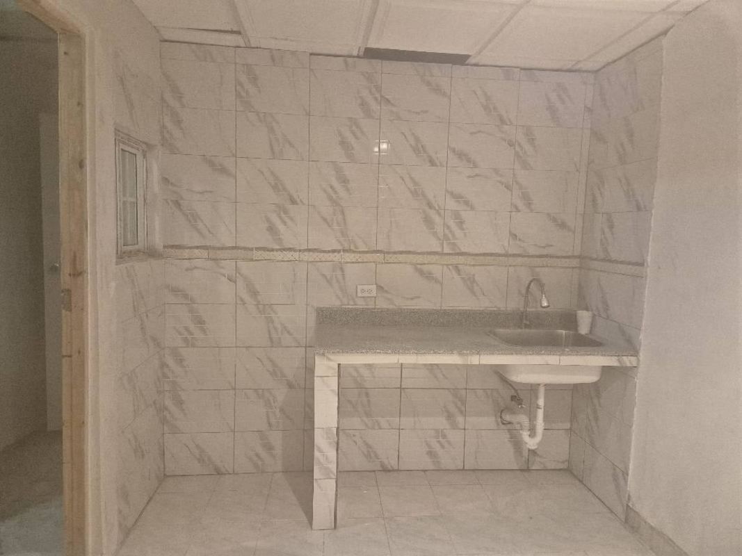 Basic tiled kitchenette with granite countertop, stainless sink PH Park Lefevre Residences Panama City