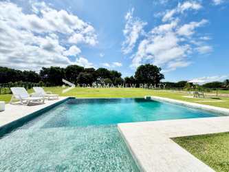 Tropical gardens lush lawn private pool in Buenaventura luxury villa Panama for sale