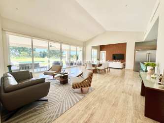 Contemporary kitchen with center island, stainless appliances, natural light in Buenaventura resort villa Panama