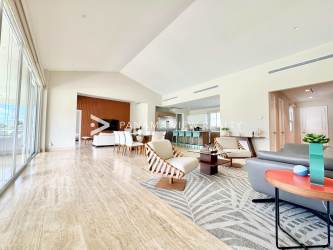 Bright living room with vaulted ceiling, large glass doors to terrace and garden in Buenaventura Panama