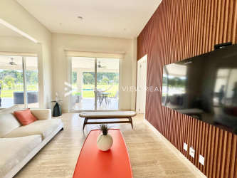 Private pool area with sun loungers and tropical garden landscape in Buenaventura Panama luxury villa