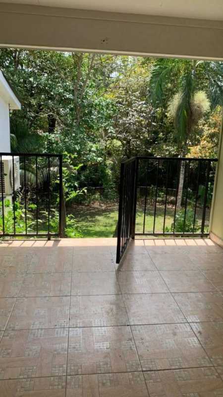 Private balcony tiled floor overlooking garden greenery Clayton Panama apartment