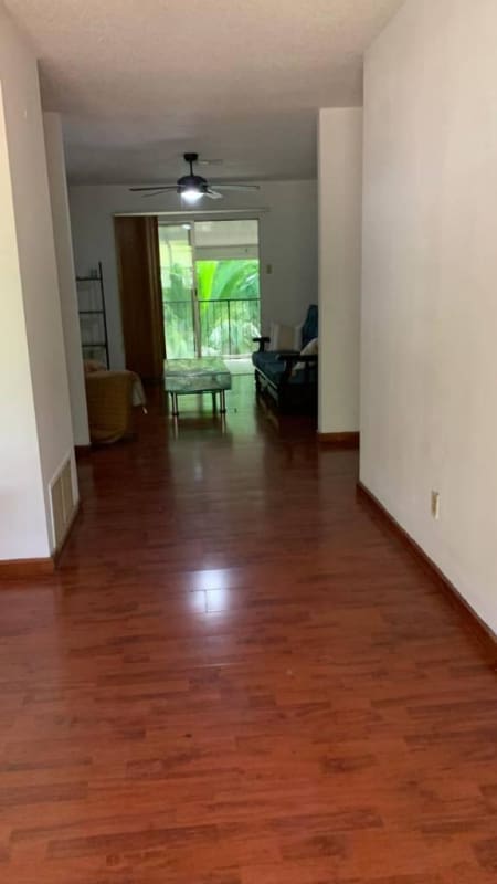 Traditional kitchen with wooden cabinets granite counters gas stove microwave in Clayton Panama