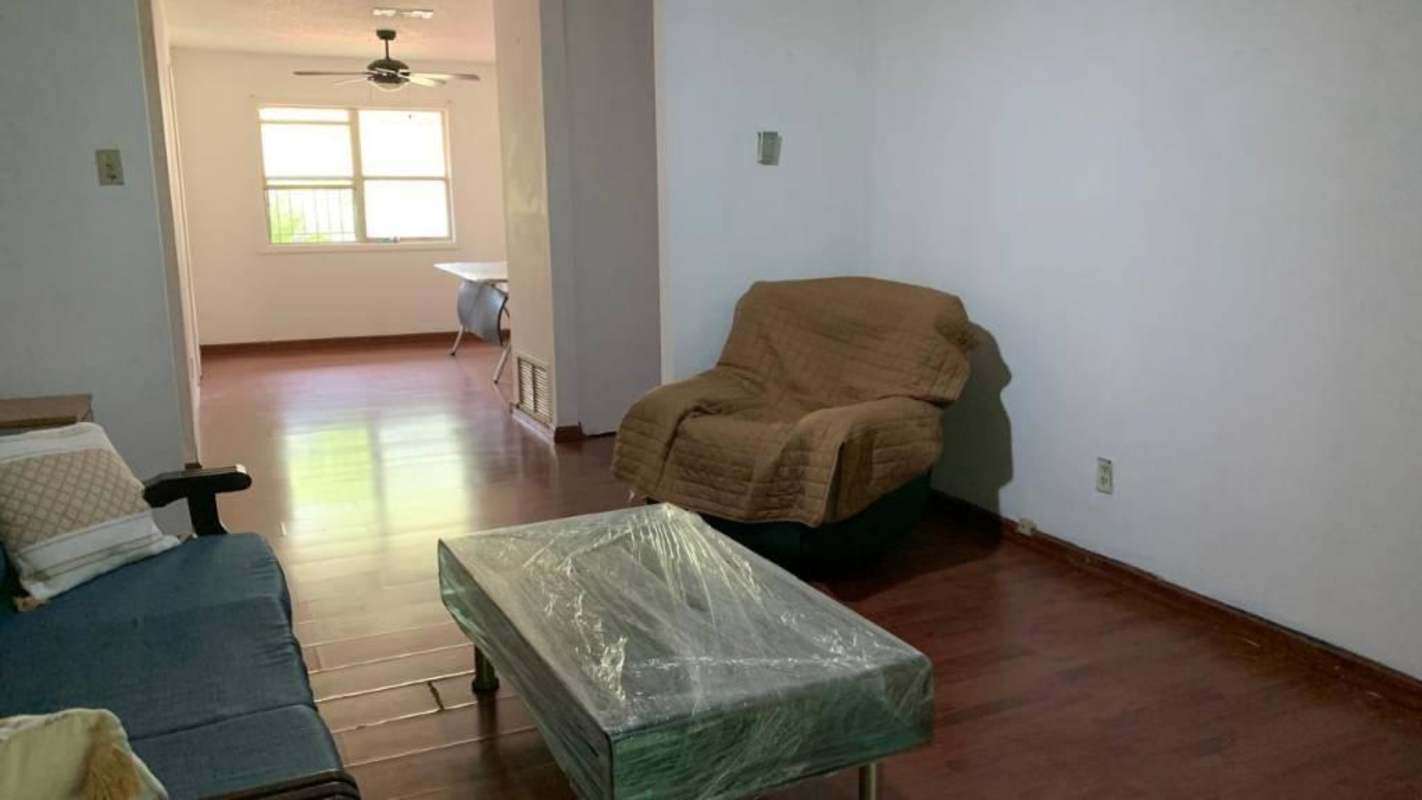 Kitchen with granite counters wood cabinets gas stove microwave Clayton Panama apartment