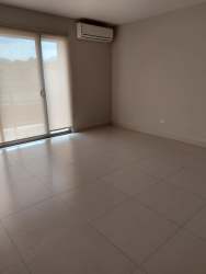 Bathroom with glass shower double sink PH Woodland Panama Pacifico apartment