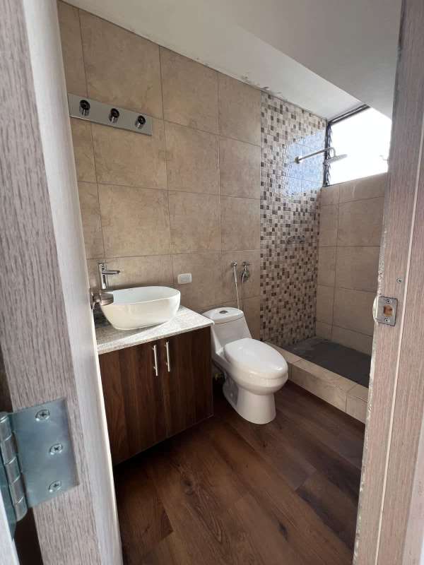 Bedroom with wood flooring and large window, remodeled PH Dorasol Panama