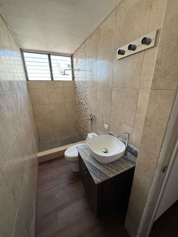 Master bedroom featuring closet, en-suite access, wood floors in PH Dorasol Panama