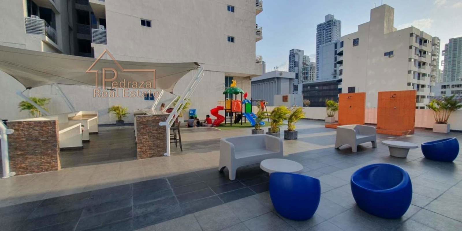 Bright living room with ocean-facing floor-to-ceiling windows in Serenity at The Bay Panama