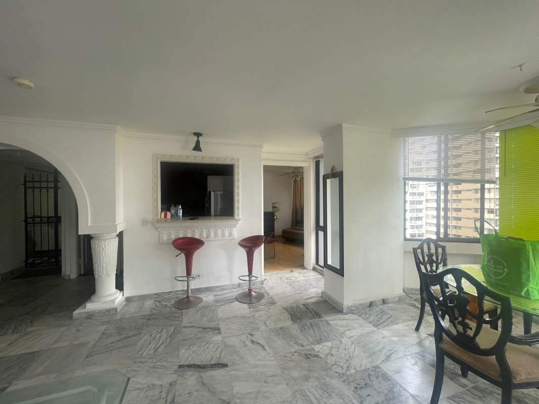 Curved sectional sofa in bright living room with large windows gas PH Las Hadas Panama City