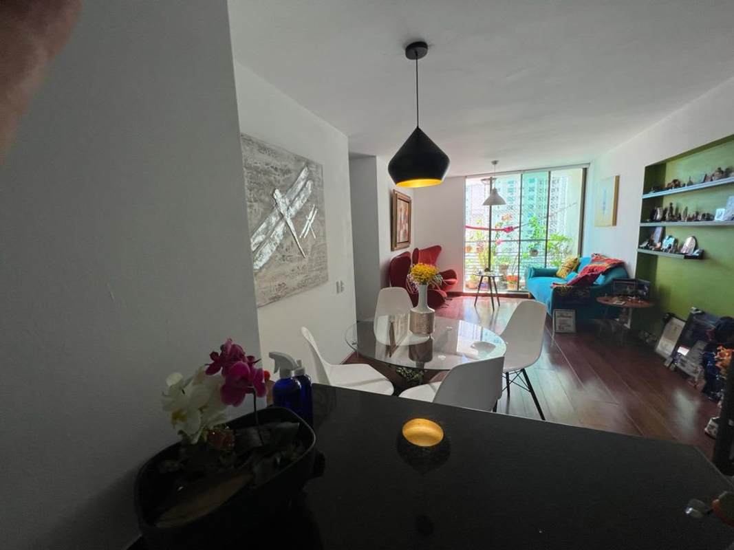 Colorful open plan living dining area with modern furnishings in Punta Pacífica condo