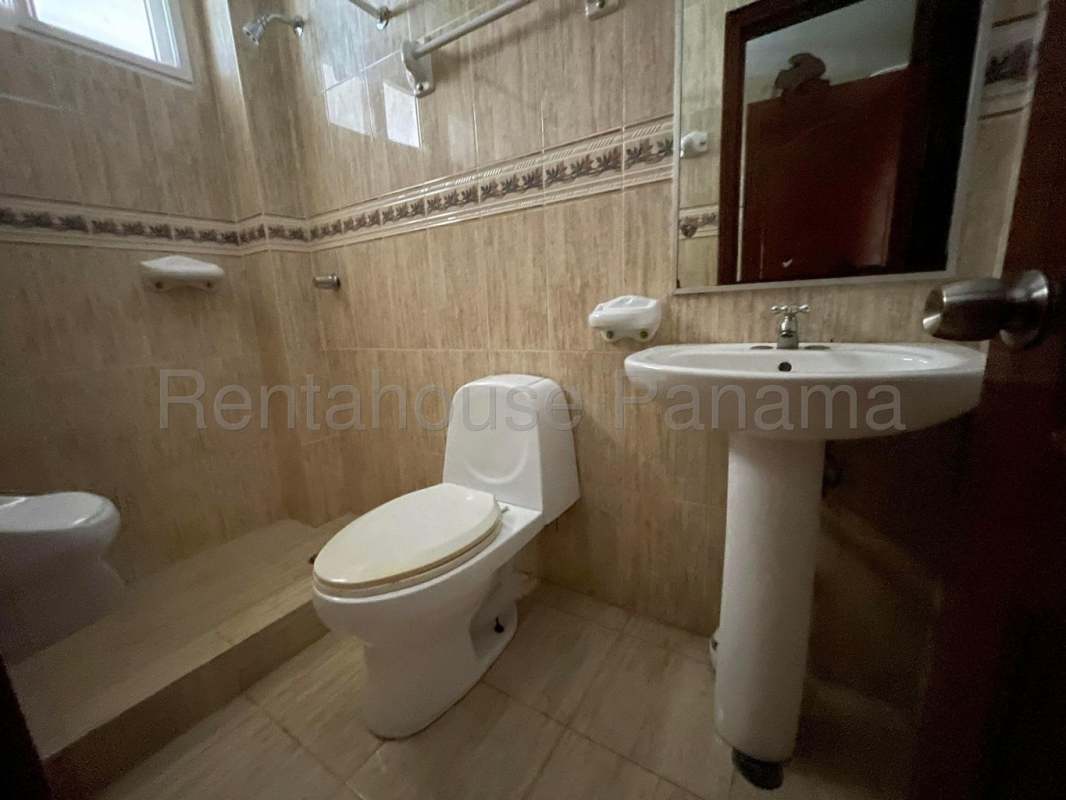 Private backyard terrace and lush garden in Ancon residential house sale