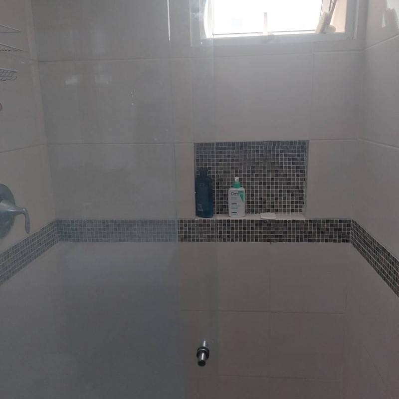 Modern private bathroom with shower ceramic tiles in Bell View Tower Edison Park Panama City