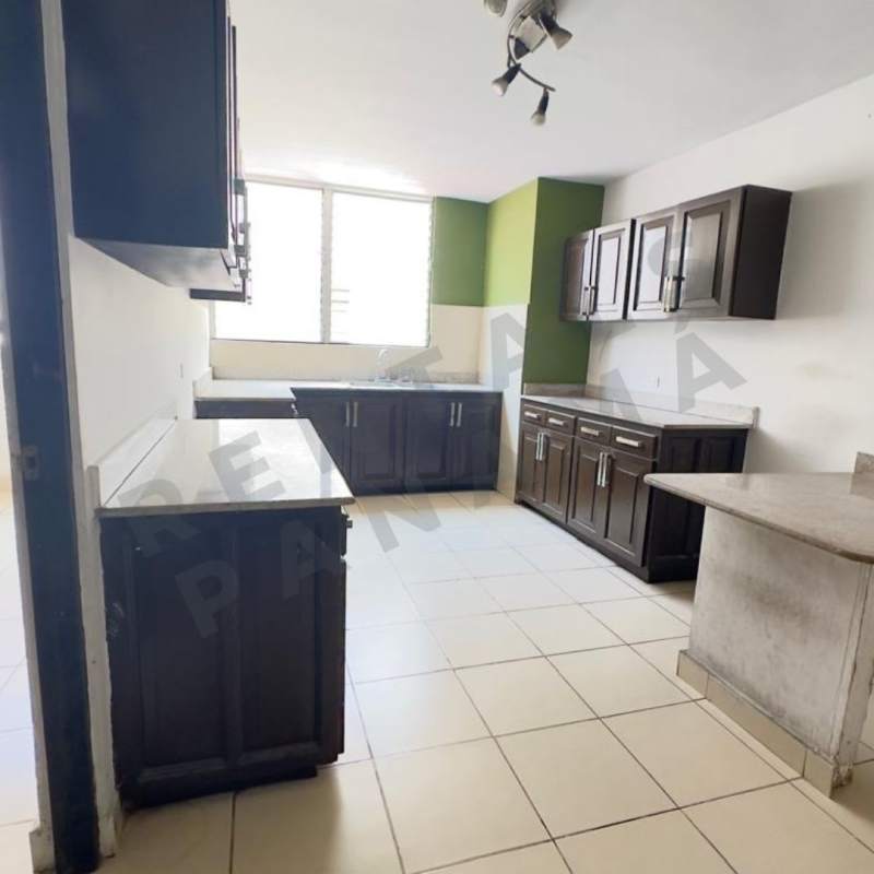 Kitchen with dark cabinets and natural light PH El Carmen Panama