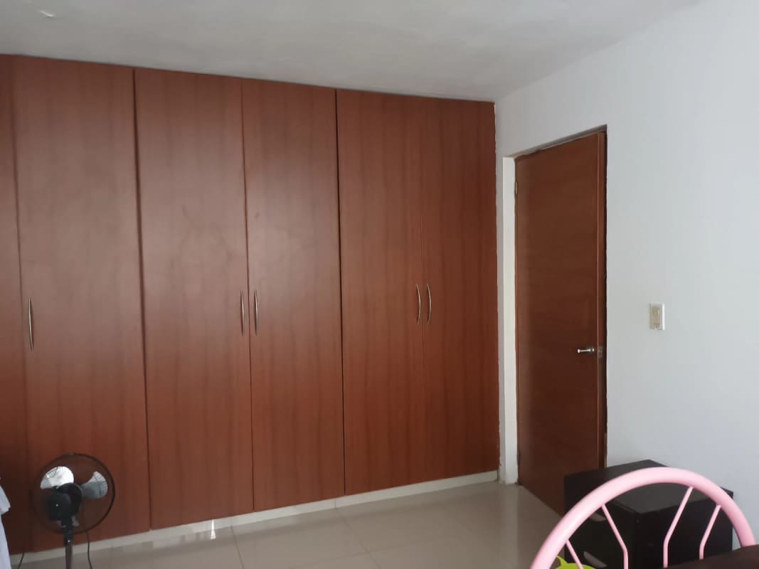 Cozy colorful shared room with geometric wall art and pink furnishings in PH Vía Argentina, Panama City