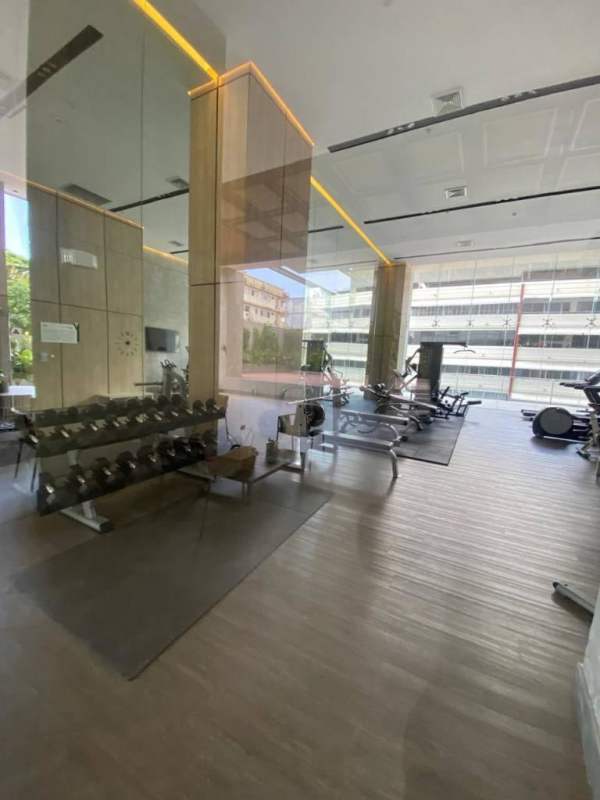 Modern fitness center with cardio equipment and weights in PH Velure luxury tower Panama for residents