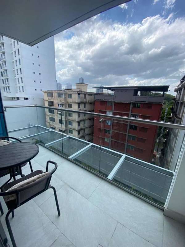 Glass-railing balcony with city view from PH Velure apartment rental in El Cangrejo Panama