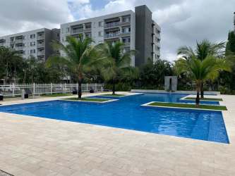 Modern open living-dining area with large windows, balcony, and contemporary furnishings at Woodlands Panama