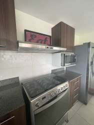 Secondary bedroom with full bed, TV and blackout shades Panama Pacifico