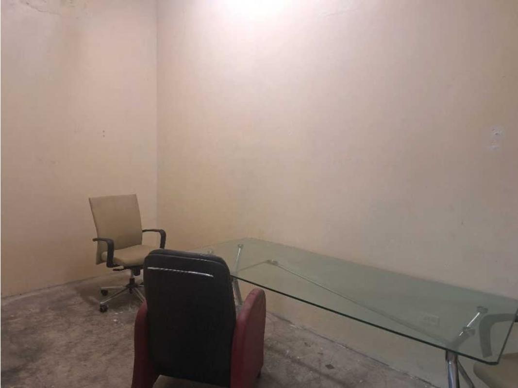 Outdoor parking lot and vehicle service bays in warehouse complex Panama City