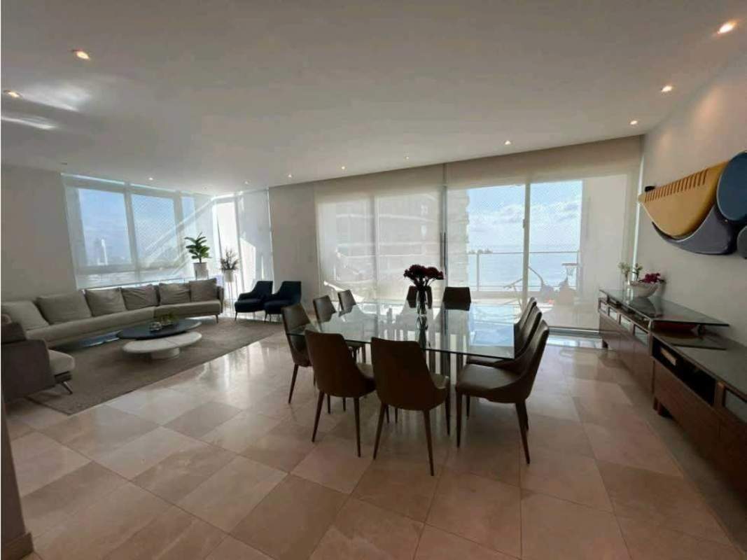 Modern kitchen with granite countertop, beige cabinetry, black granite Pacific Village Panama
