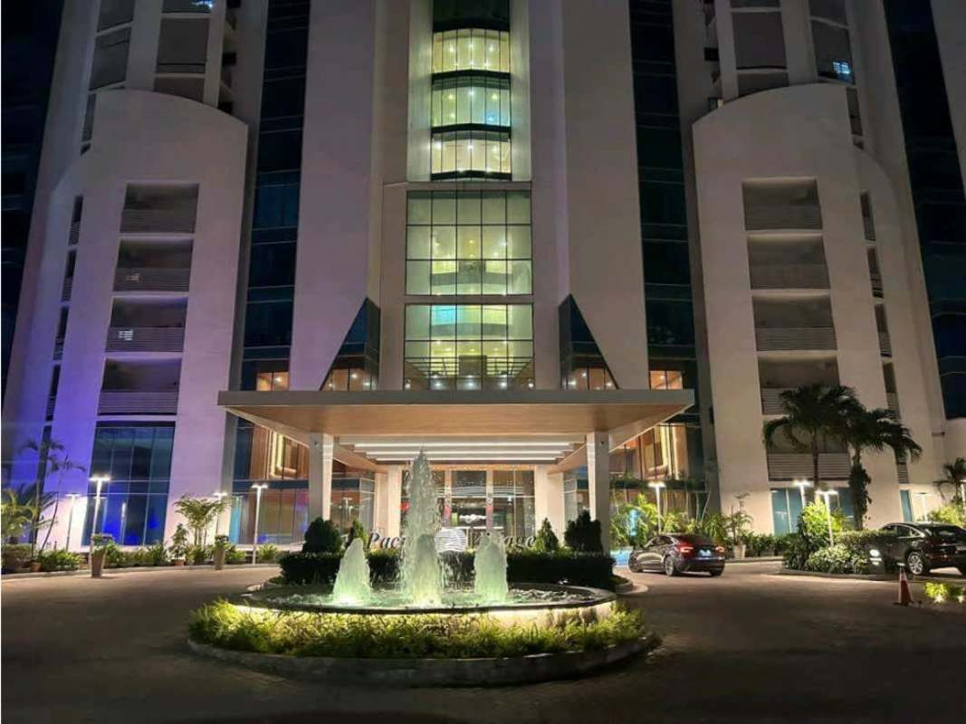 Master bedroom with king size bed, ocean and city views in Pacific Village Panama