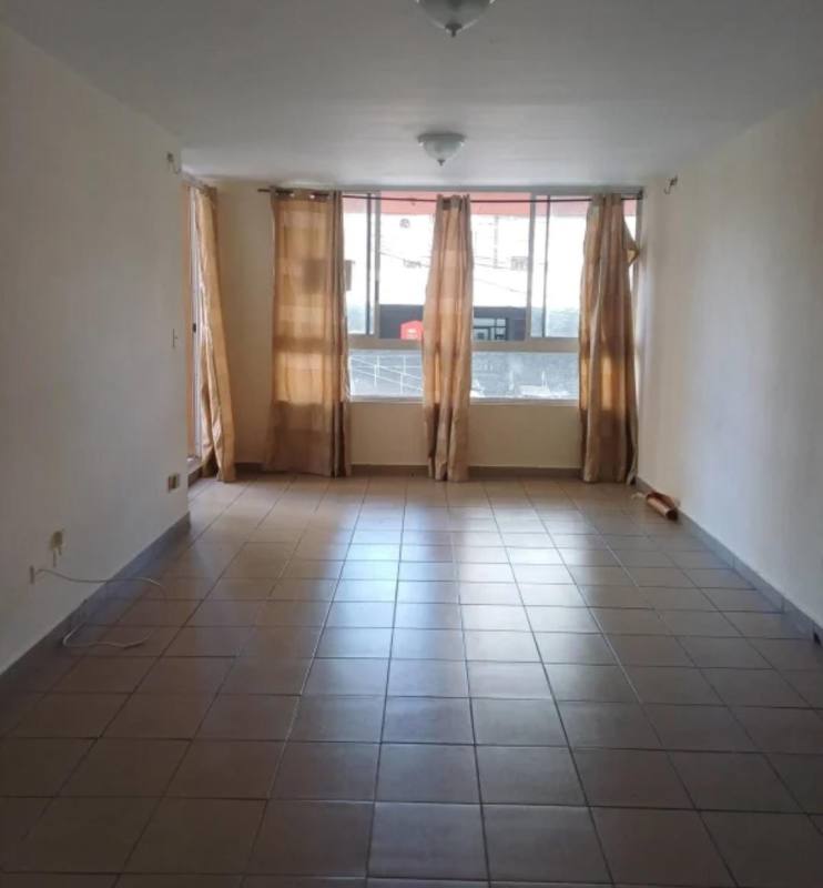 Modern galley kitchen with refrigerator stove and window PH Terrazas de San Francisco Panama