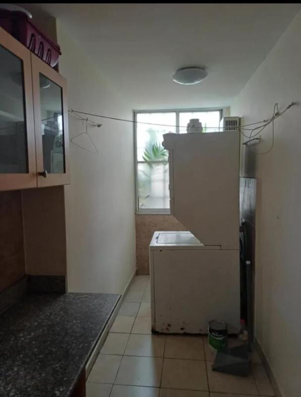 Laundry area with washer stacked appliances PH Terrazas de San Francisco Panama City