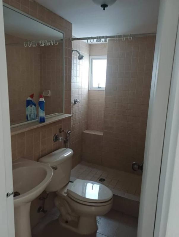 Bathroom with beige tiles walk-in shower vanity sink PH Terrazas San Francisco Panama