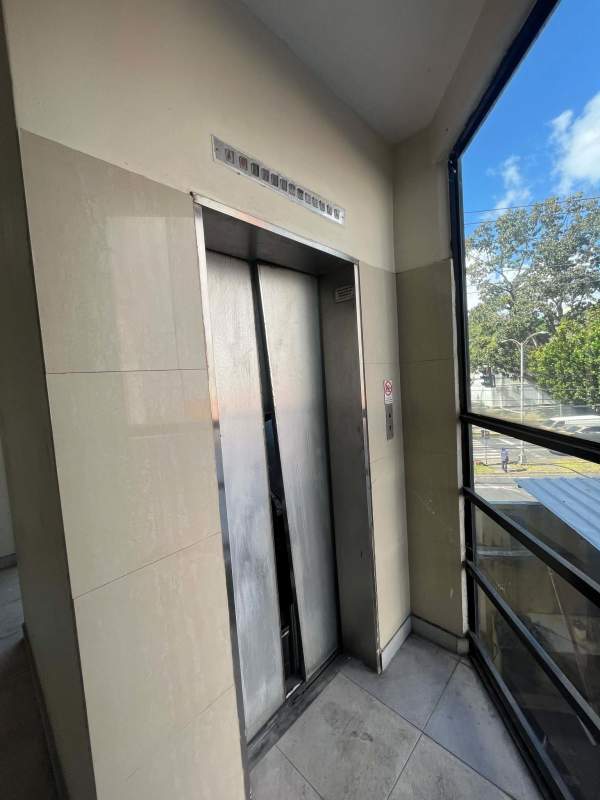 Elevator lobby with large corner window at PH Cemento El Cangrejo Panama