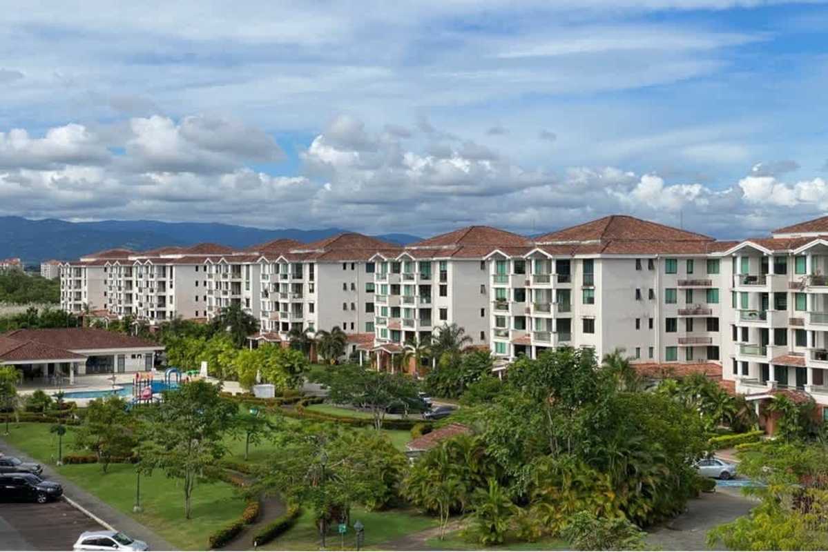 Unfurnished modern open kitchen with granite countertop and island at PH Costa Sur Village Panama