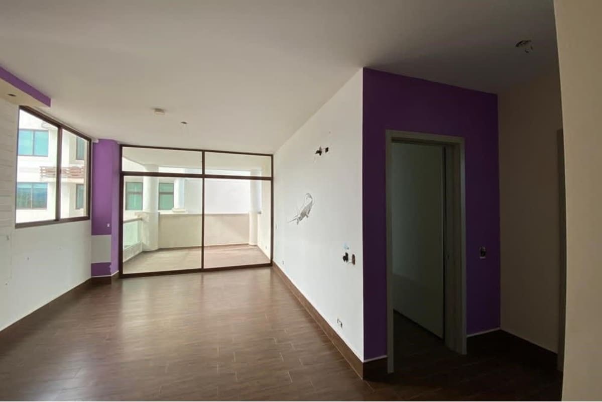 Bright open living area with sliding doors to large terrace in PH Costa Sur Village Panama City