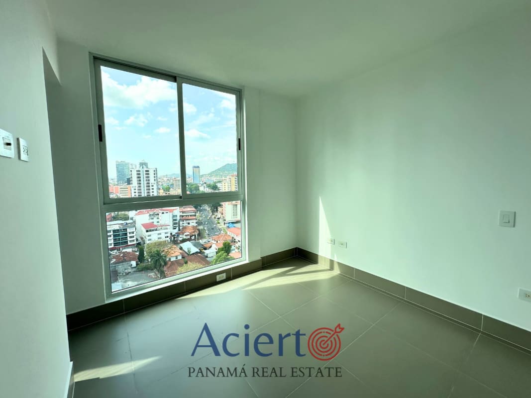 Gym with cardio equipment, free weights and skyline views at Bella Vista Park Panama City