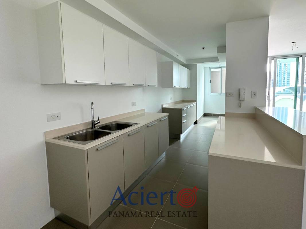 Contemporary minimalist kitchen with double sink, breakfast bar, white cabinets in Bella Vista Park Panama City