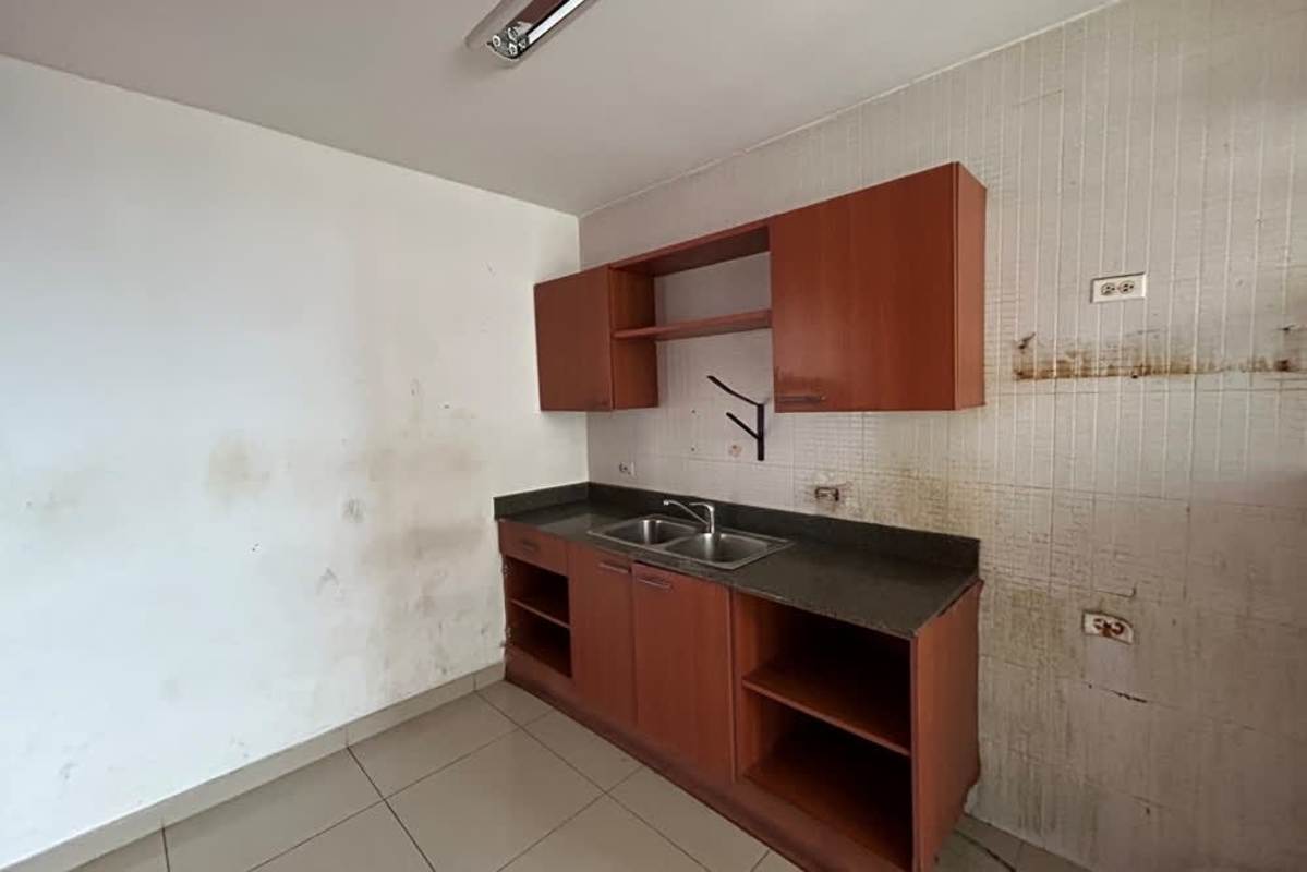 Closed kitchen with wooden cabinets and double sink in PH San Francisco City Central Panama.
