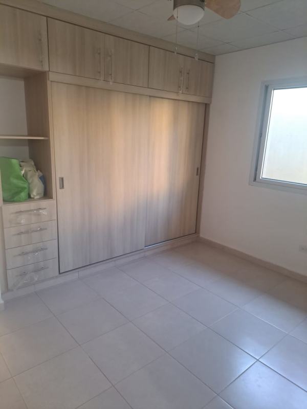 Exterior suburban house with double carport and garden PH Palermo Nuevo Tocumen Panama