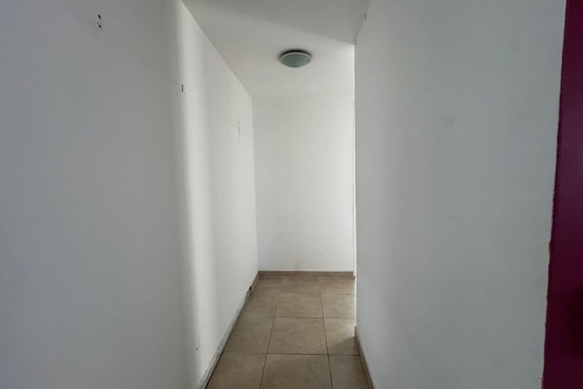 Large living and dining room with floor-to-ceiling windows ocean views PH Bahia Pacifica Panama City