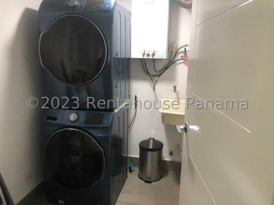 Laundry room with stacked washer dryer and sink PH Nautica Panama