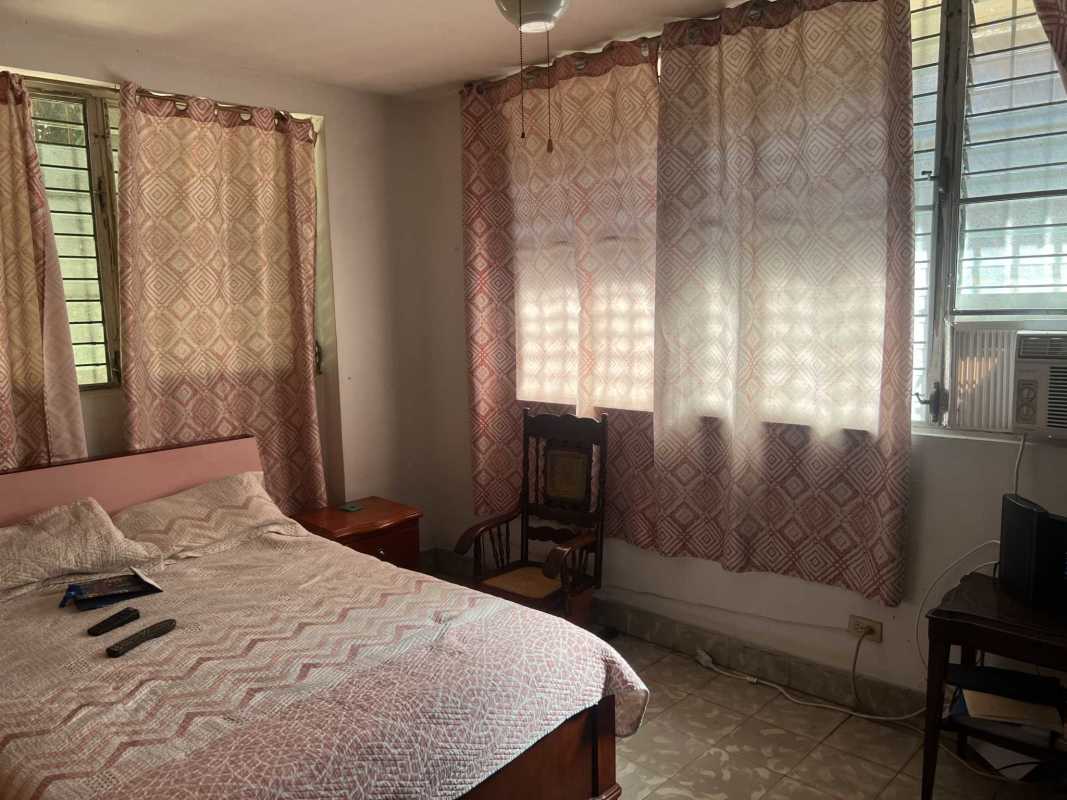 Second large bedroom with windows tiled floors in PH El Cangrejo Residences Panama City