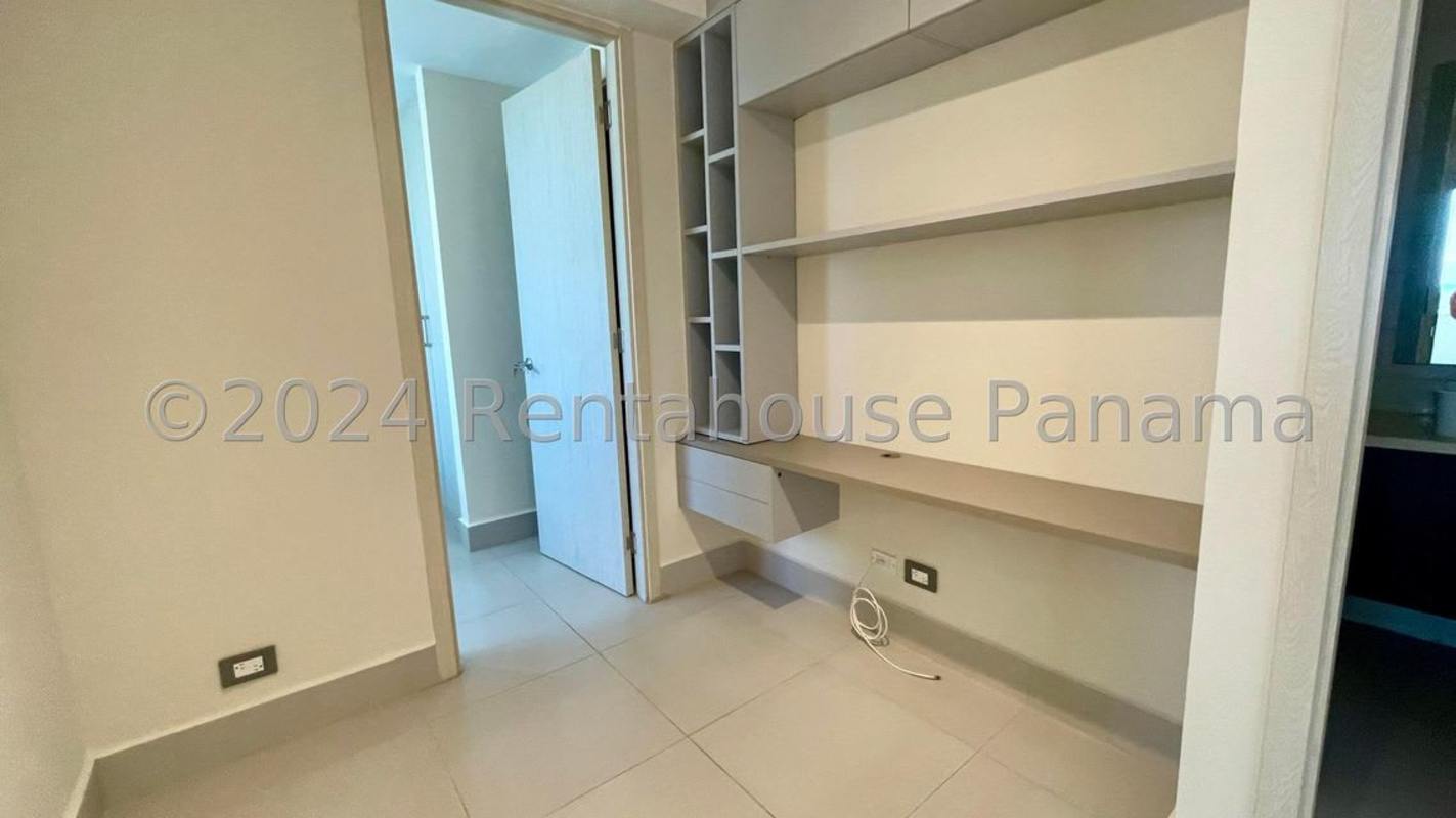 Spacious living area with balcony access in PH Sky Point apartment Panama City