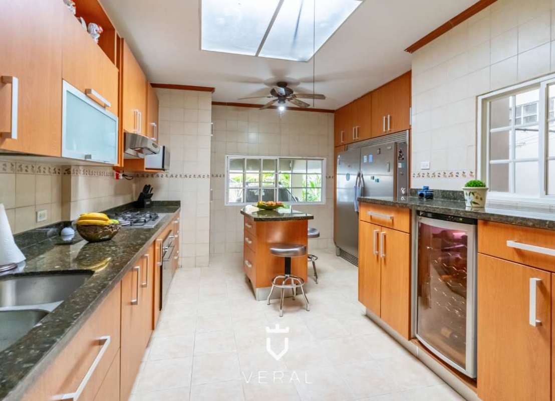 Contemporary remodeled kitchen granite countertops island appliances in La Loma House Panama City