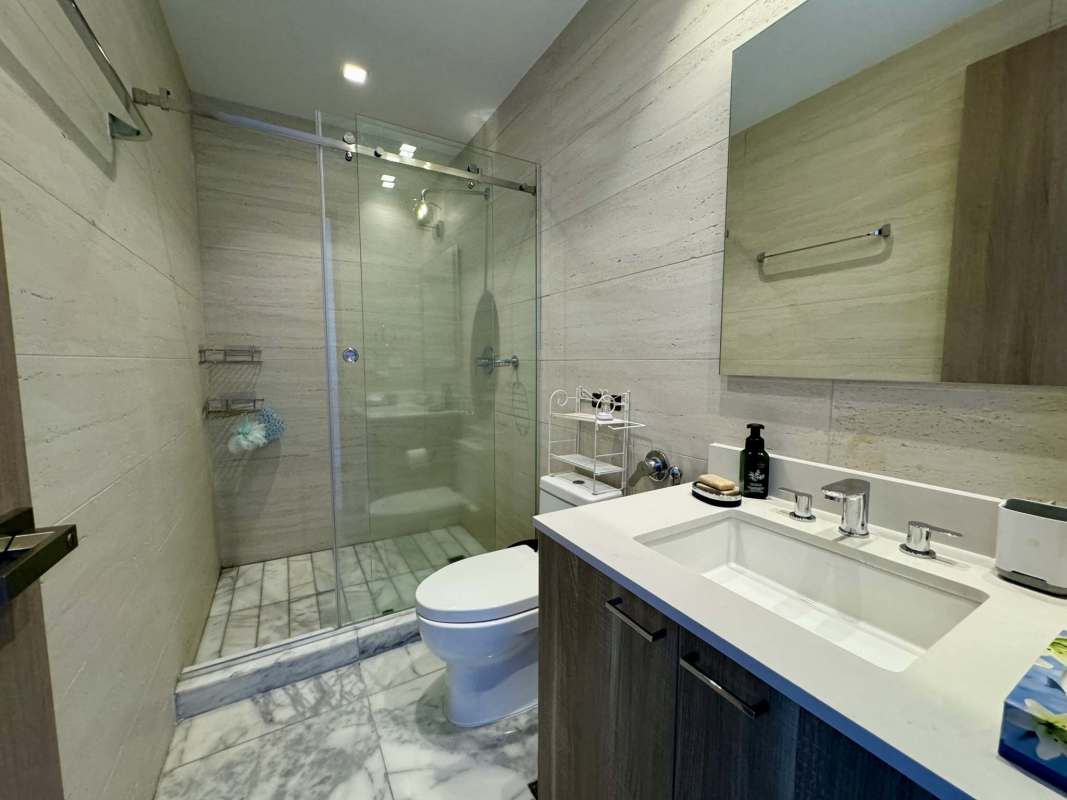 Modern bedroom with large windows and marble floors in PH Ocean Front Punta Paitilla