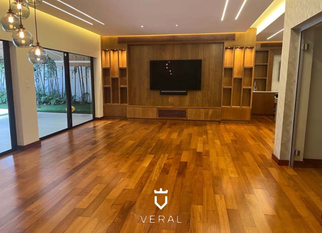 Covered outdoor patio with BBQ area next to private swimming pool in Costa del Este luxury residence