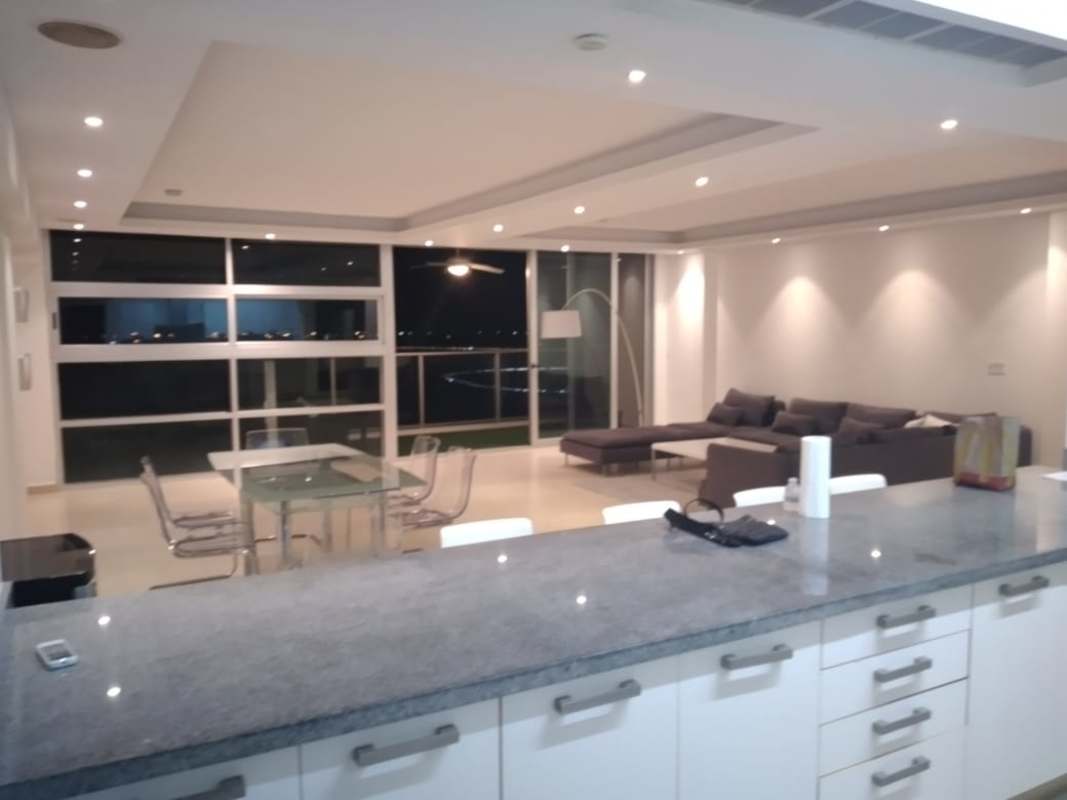 Modern living room with panoramic ocean view windows at PH Waters on the Bay Avenida Balboa Panama