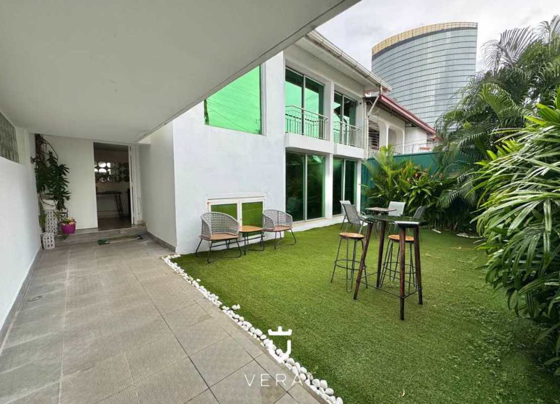 Spacious living room with marble floors and sliding doors at La Alameda Betania home Panama